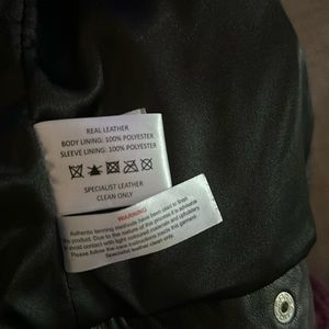 Black leather jacket never worn size 12 super soft REAL leather.